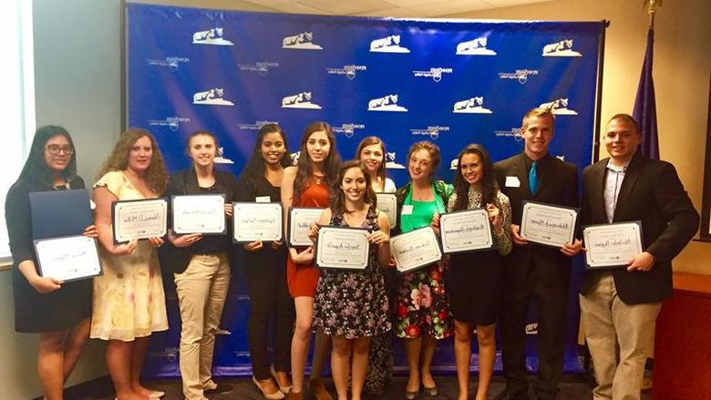 group of students pose with their awards